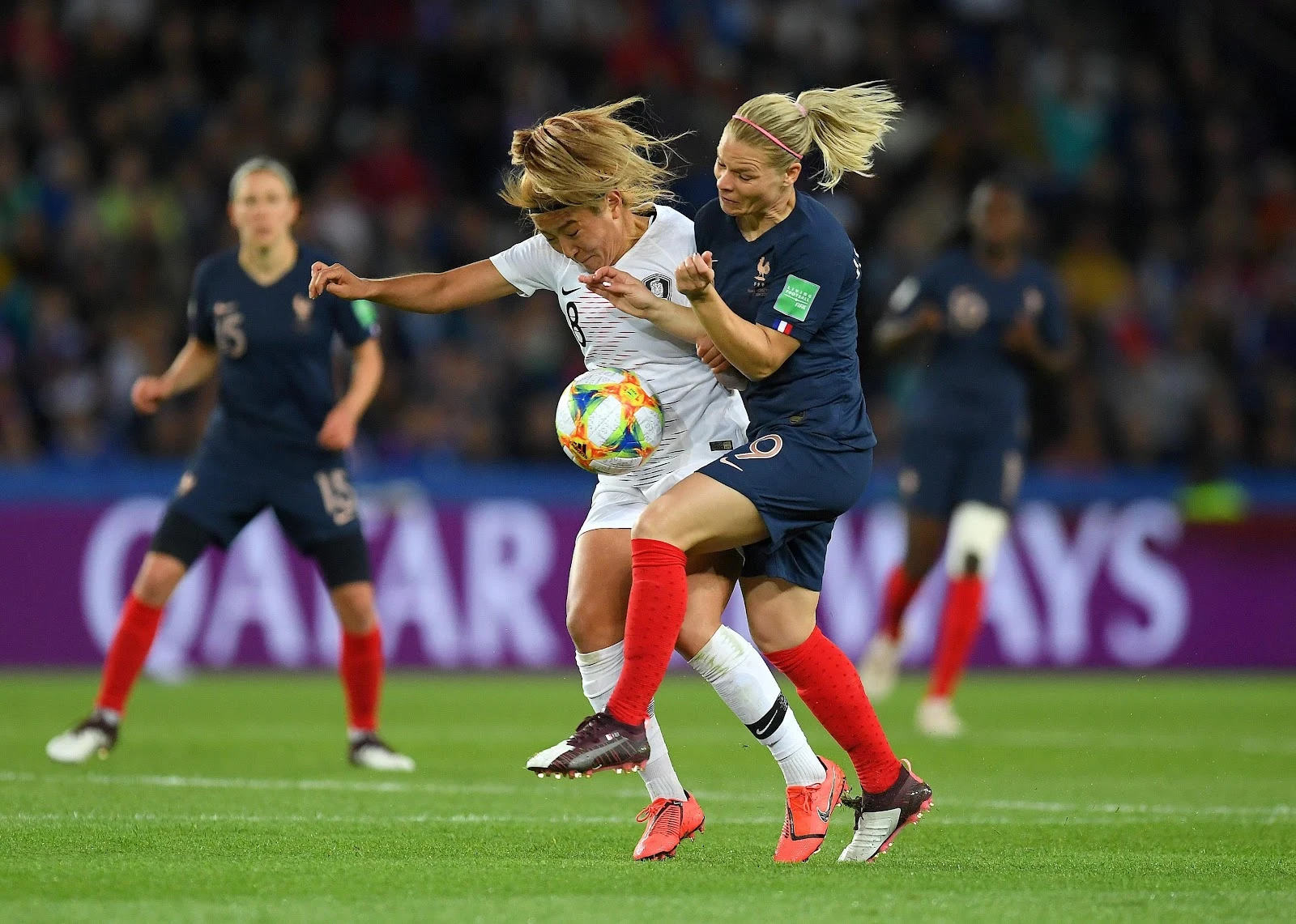 Eugenie Le Sommer of France battling for possession with Sohyun Cho of Korea Republic during the 2019 FIFA Women's World Cup France.