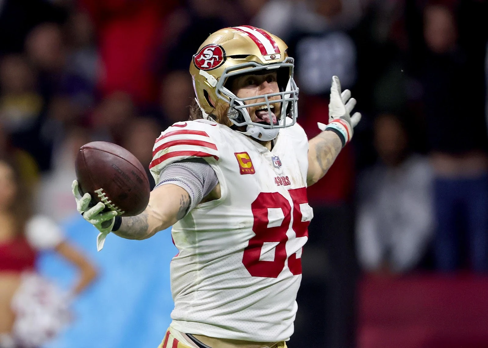 George Kittle #85 of the San Francisco 49ers scores a touchdown.